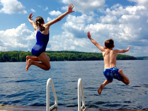 Kids jumping off dock